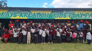 Children and teachers from All Is Grace School pose together during one of their school trips to Kreation Kids Play Park