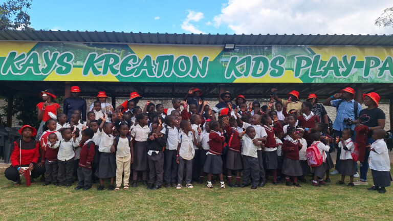 Children and teachers from All Is Grace School pose together during one of their school trips to Kreation Kids Play Park