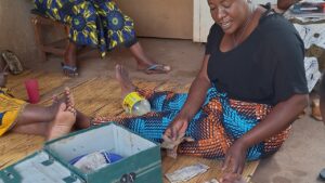 Pamela leading a women’s savings club teaching financial literacy for women in Zambia