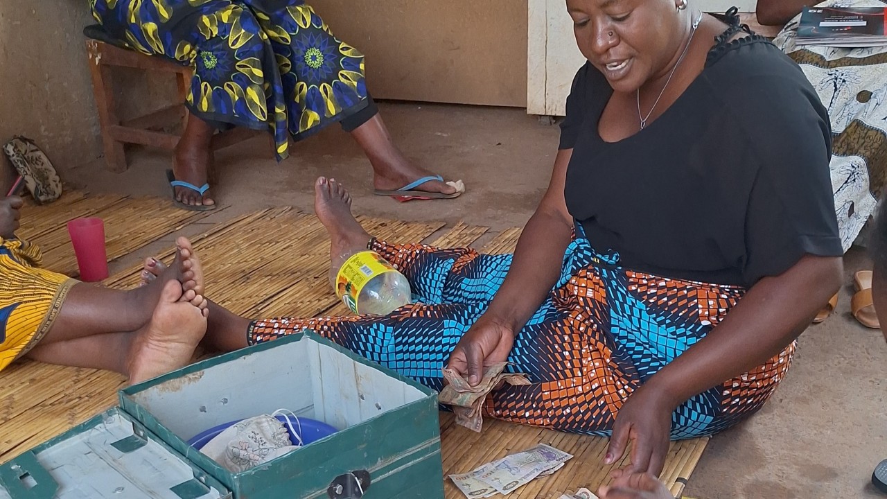 Pamela leading a women’s savings club teaching financial literacy for women in Zambia